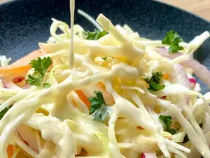 gluten-free salad dressing poured over coleslaw