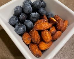 almonds and blueberries in a square white dish almonds and blueberries in a square white dish