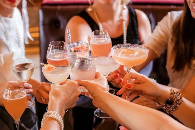 women toasting with drinks