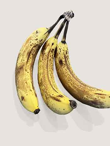 ripe bananas on beige background