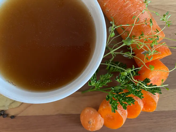 gluten-free beef bone broth with carrots and herbs