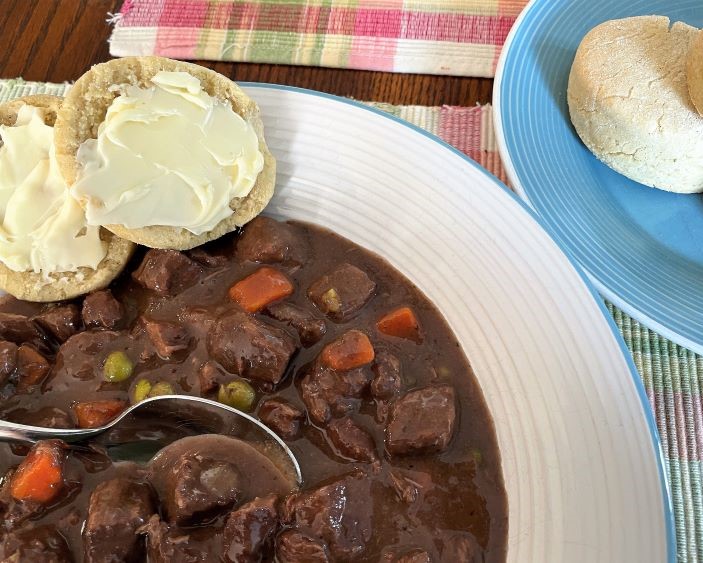 beef stew plated with gluten free biscuits