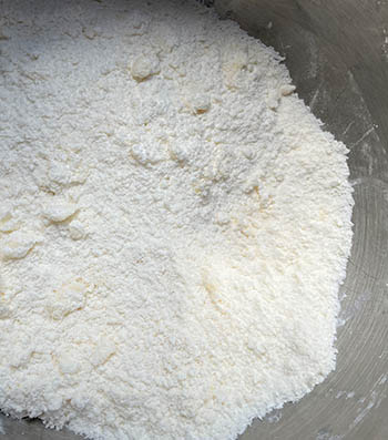 butter and gluten free biscuit mix combined in bowl