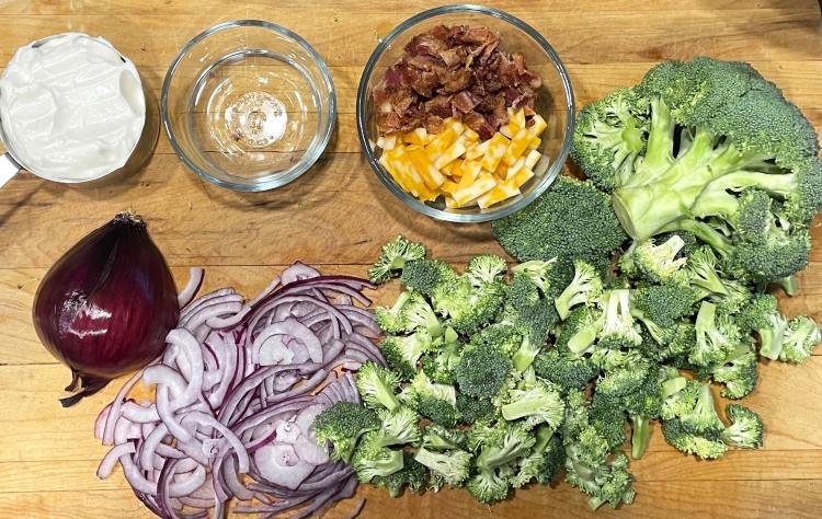 broccoli salad ingredients - broccoli, cheddar, bacon, mayonnaise, vinegar, sugar, red onion
