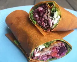 gluten free carrot wrap on a blue plate