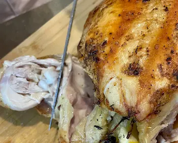 removing leg from roasted chicken