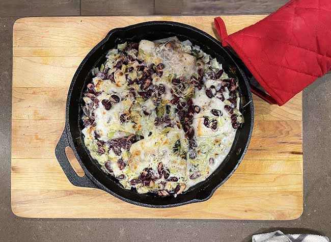 Easy Gluten-Free Meals: cast iron pan with creamy fish and bean dish.  Handle held by red oven mitt. Easy Gluten-Free Meals: cast iron pan with creamy fish and bean dish.  Handle held by red oven mitt.