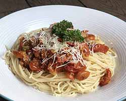 Gluten-free spaghetti with roasted cherry tomato sauce.