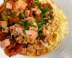 chicken basque plated with rice