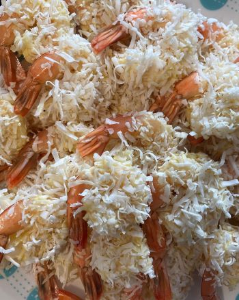 uncooked coconut shrimp on plate uncooked coconut shrimp on plate