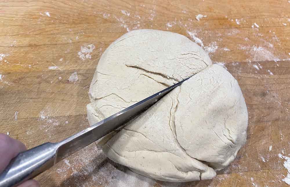 knife cutting pizza dough knife cutting pizza dough