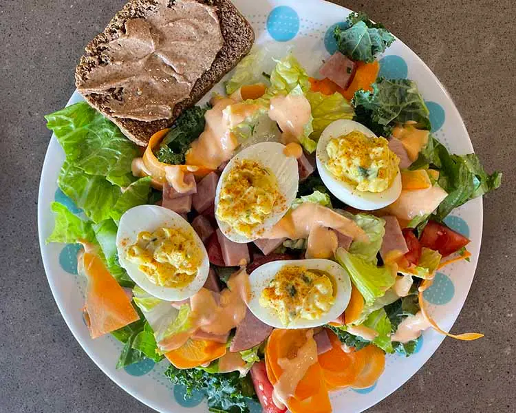 plate of devilled eggs and salad plate of devilled eggs and salad
