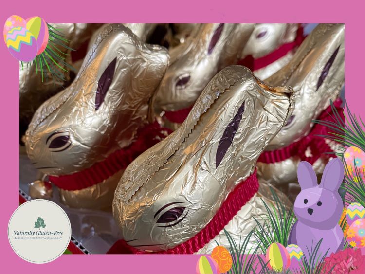 Lindt bunnies on pink background with Easter decorations Lindt bunnies on pink background with Easter decorations