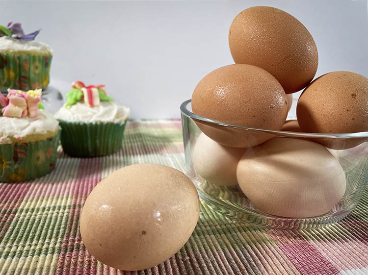 eggs with cupcakes in background