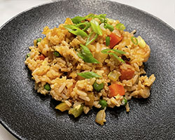 gluten free fried rice on a black plate