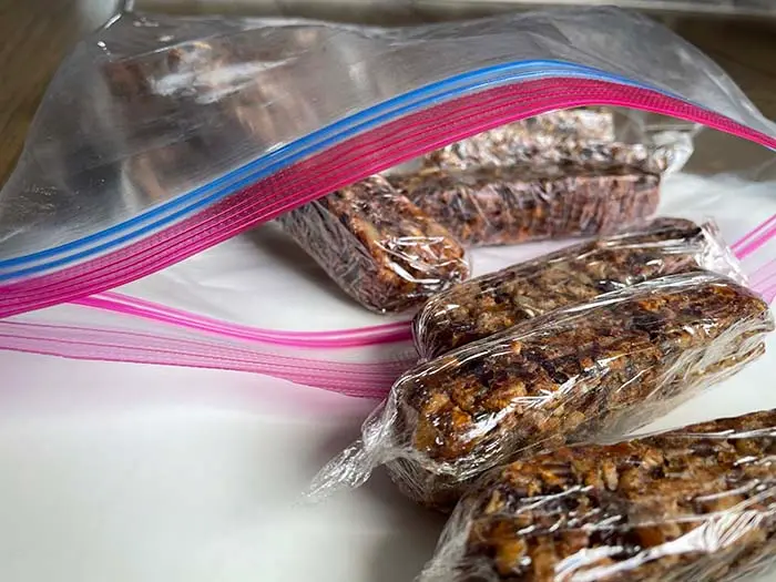 gluten free granola bars wrapped in plastic and stored in a ziplock bag