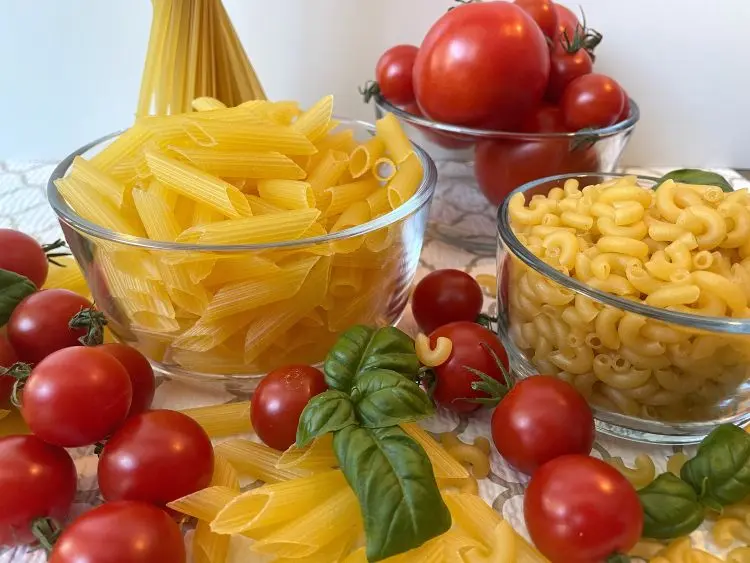 medley of gluten free pasta displayed with tomato and basil medley of gluten free pasta displayed with tomato and basil