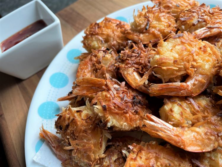gluten free coconut shrimp on plate with sauce gluten free coconut shrimp on plate with sauce