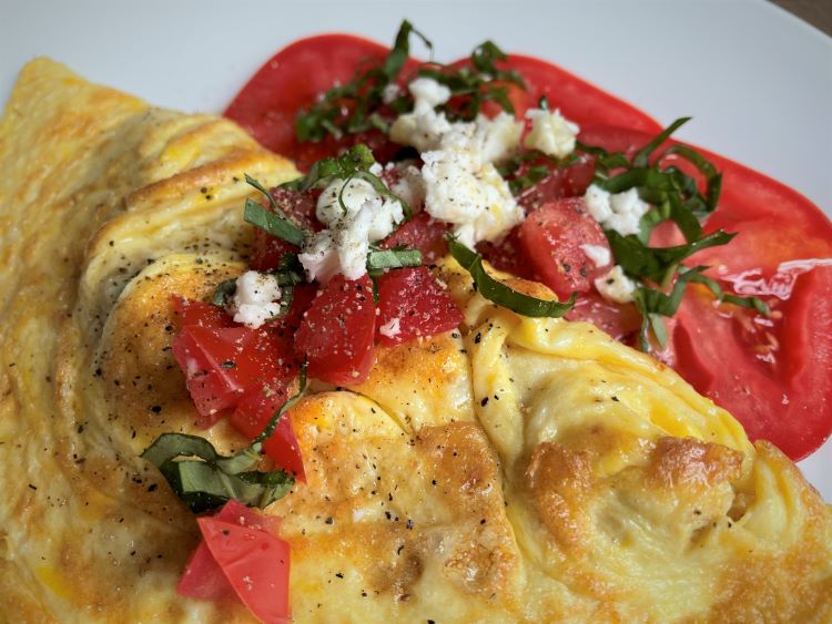 omelet with tomato, feta and basil.