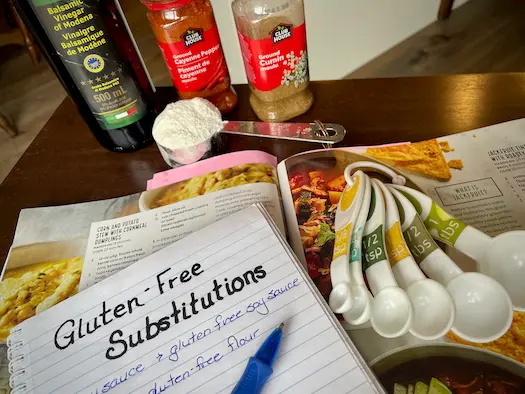Adapting a recipe using gluten-free substitutions with a cookbook and notes