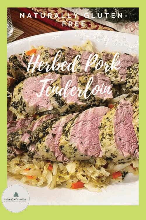 pinterest image of herbed pork tenderloin on a bed of warm cabbage salad.