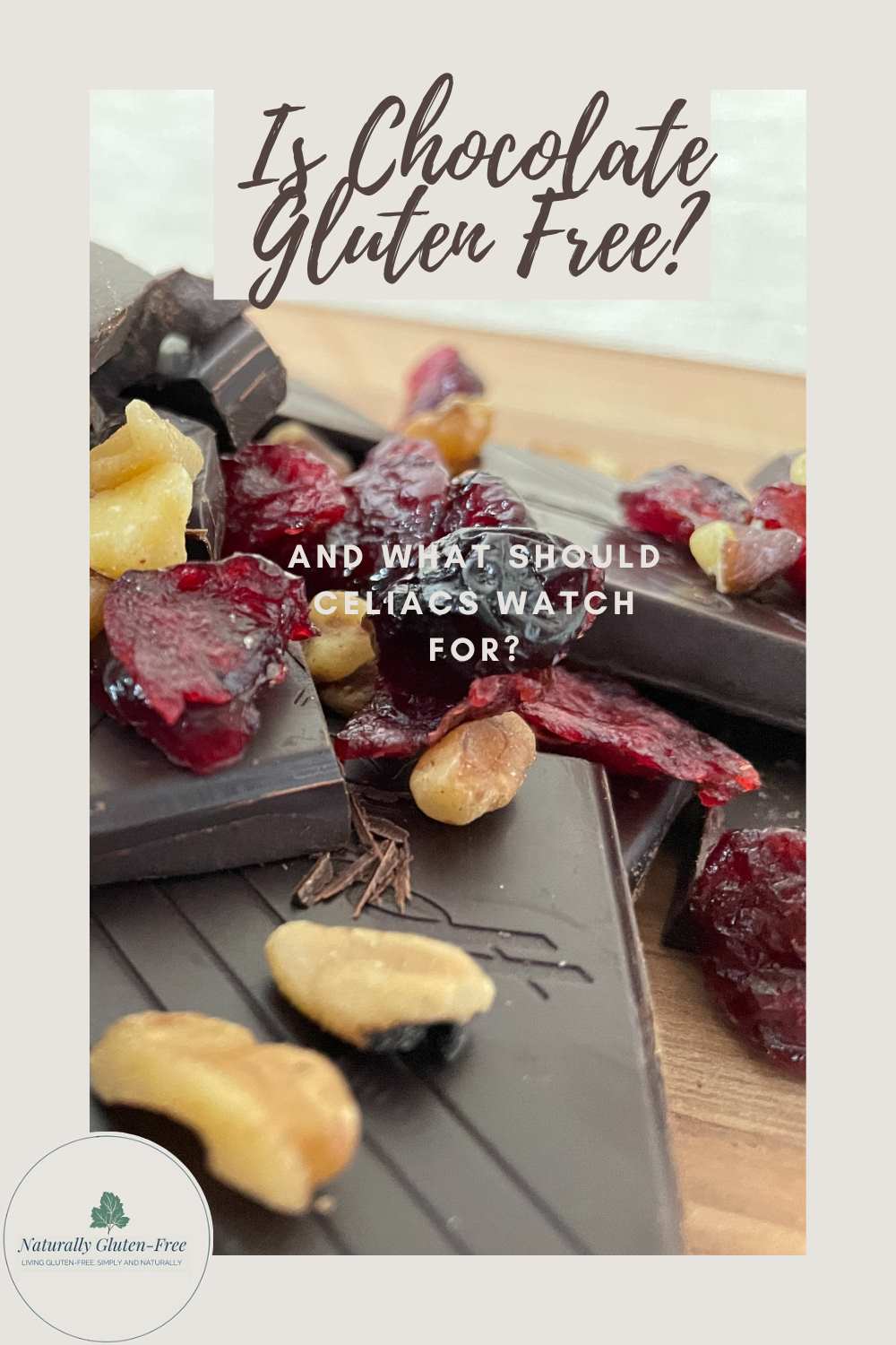 Is chocolate gluten free, pinterest image of chopped chocolate with dried cranberries and nuts.