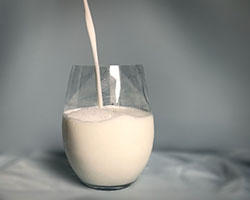 milk pouring into a glass