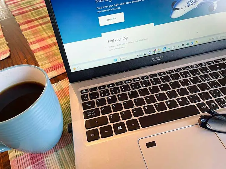 laptop with coffee and glasses