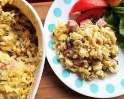 macaroni casserole in baking dish and plated with fresh veggies