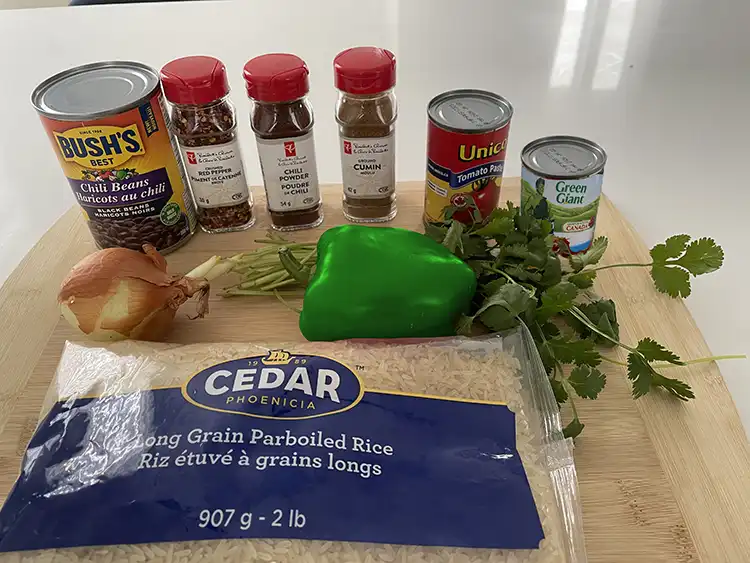 mexican rice ingredients on wooded cutting board mexican rice ingredients on wooded cutting board
