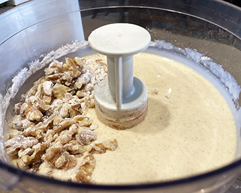 banana bread batter and walnuts in food processor