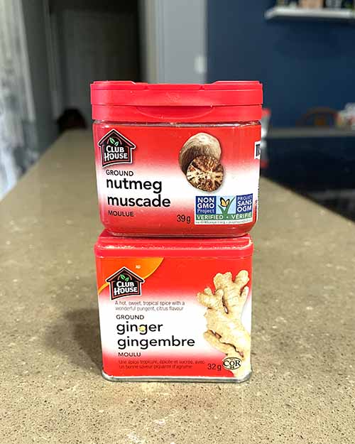 stacked cans of nutmeg and ginger stacked cans of nutmeg and ginger