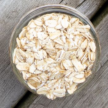 oats in a jar on a rustic background