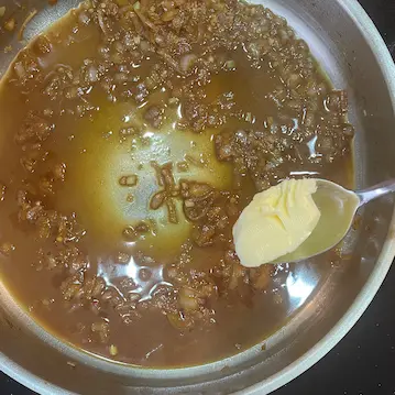 adding butter to pan sauce