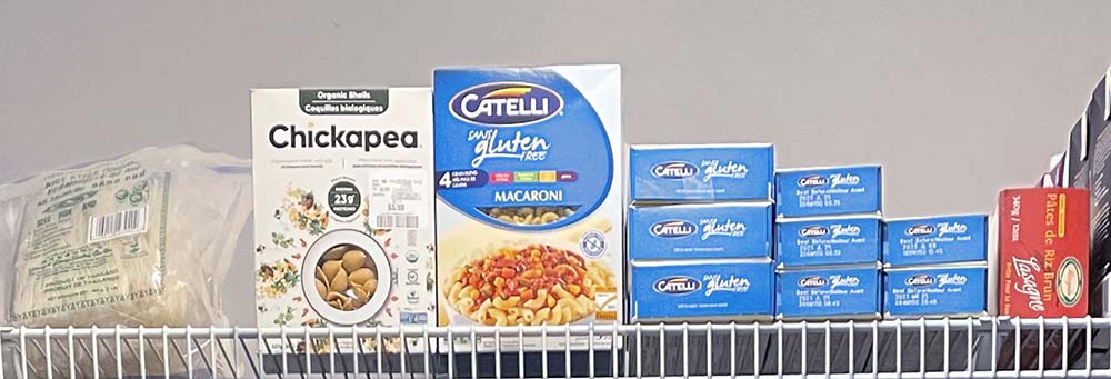 gluten-free pasta in boxes on pantry shelf gluten-free pasta in boxes on pantry shelf