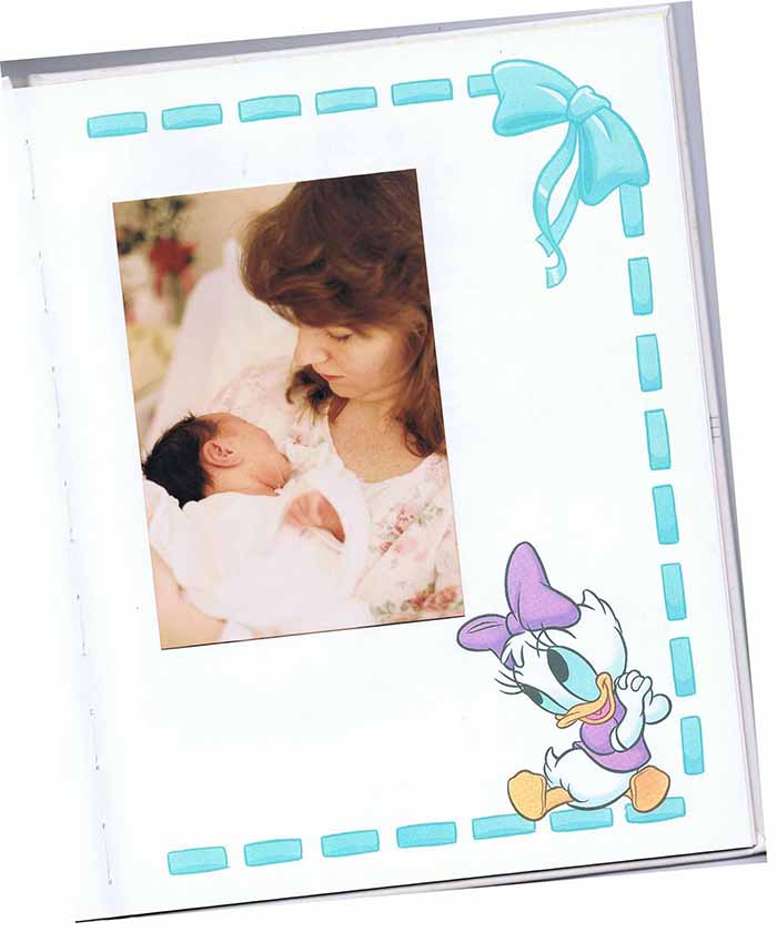 Patty Maguire with newborn daughter Sarah Christopher.  Photo on the  page of a baby book with Daisy Duck.