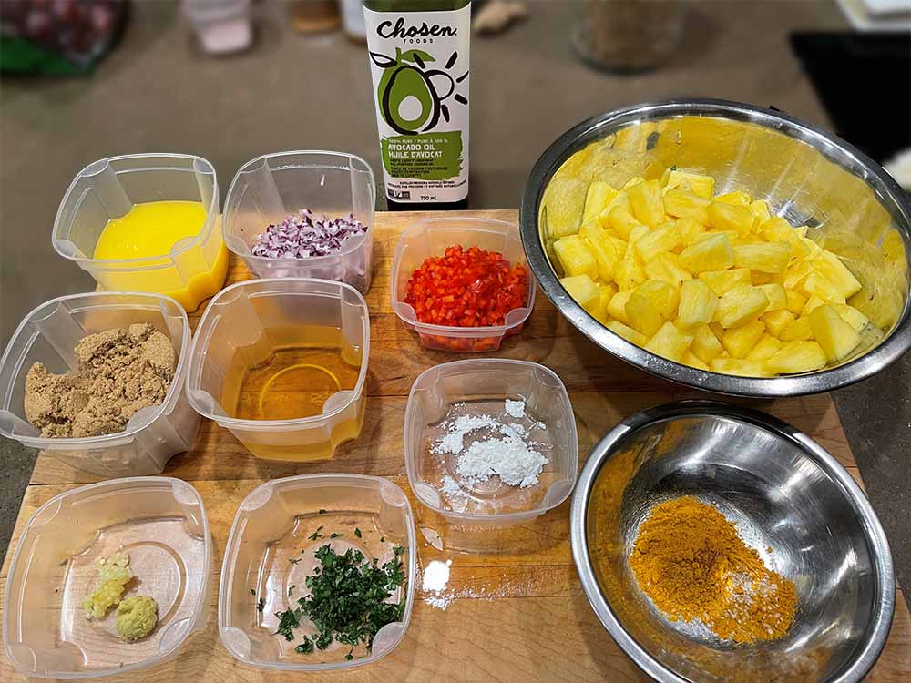 Cubed pineapple, diced red bell pepper and red onion. Avocado oil. orange juice, apple cider vinegar, minced garlic and grated ginger. Corn starch and chopped cilantro.