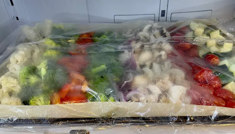 Prepared sheet pan in the fridge