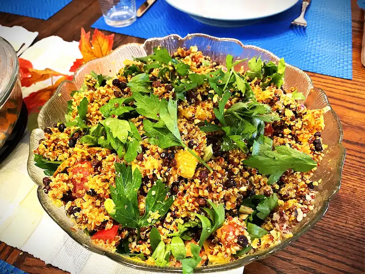 quinoa salad in decorative glass bowl on set table quinoa salad in decorative glass bowl on set table