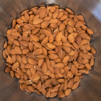 raw almonds in a metal bowl