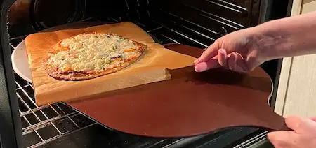 removing potato pizza crust from oven removing potato pizza crust from oven