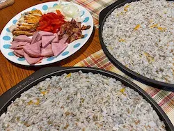 tow pizza pans with rice crust pizza