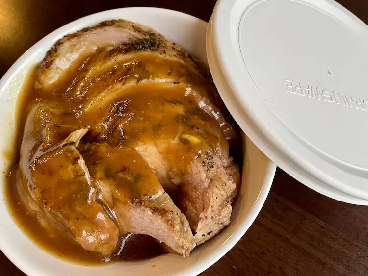 roast pork with gluten-free gravy in a storage container with a lid roast pork with gluten-free gravy in a storage container with a lid