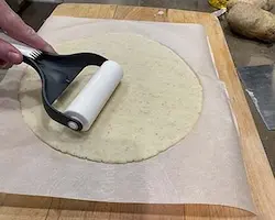 rolling out potato pizza dough rolling out potato pizza dough