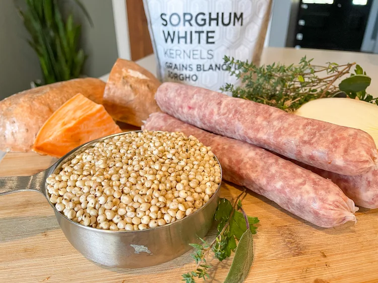 Sorghum on cutting board with ingredients for braised sausages Sorghum on cutting board with ingredients for braised sausages