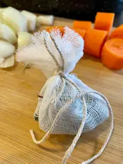 spice bag in cheesecloth tied with string