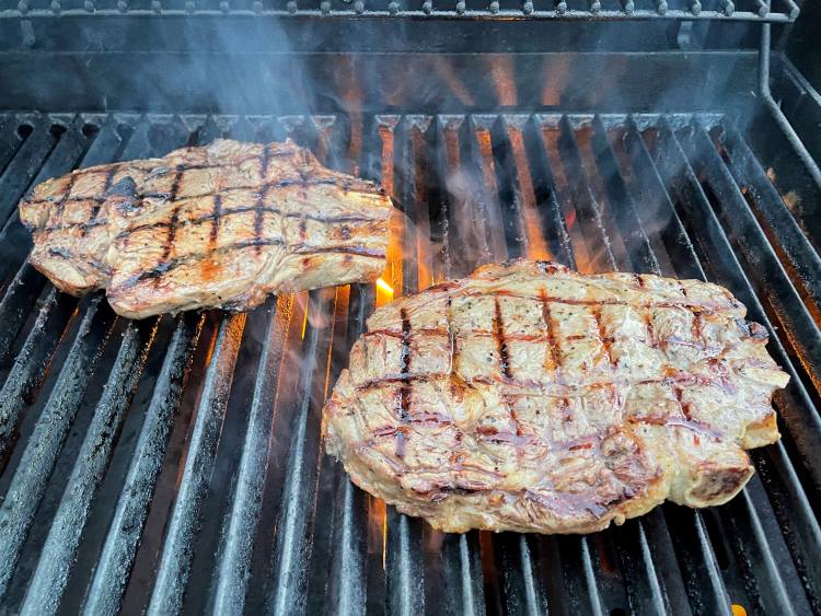 two steaks on barbecue two steaks on barbecue