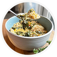 thai chicken curry on spoon with bowl in background