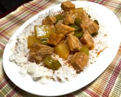 sweet and sour pork plated with rice