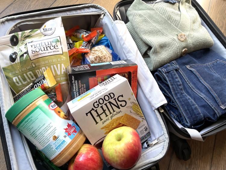 travel snacks in a suitcase with clothing travel snacks in a suitcase with clothing